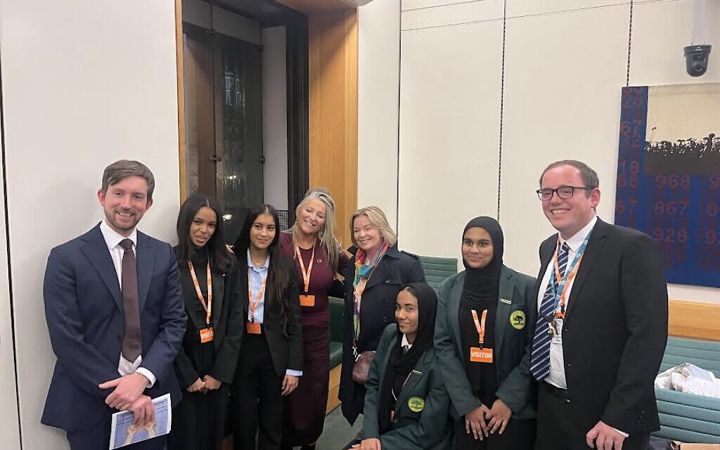 Dan Tomlinson MP, left with some of the participants in Holocaust stories project