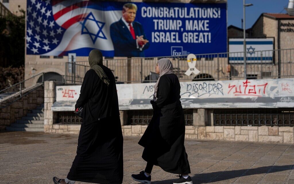 A sign that displays a photo of U.S. President-elect Donald Trump and reads "Congratulations! Trump, make Israel great!" is projected two days after the U.S. election, in Jerusalem.