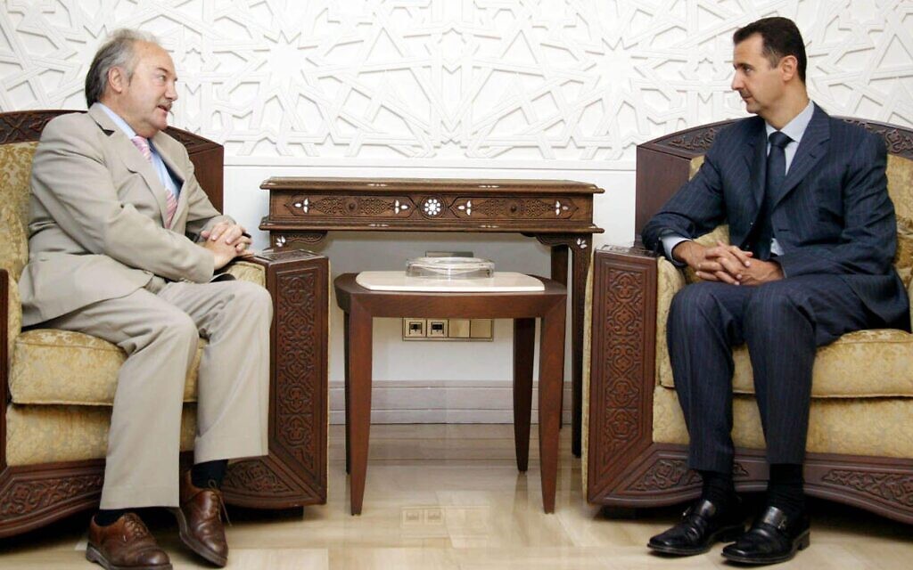 Now deposed Syria President Bashar Assad, right, meets George Galloway in Damascus in 2005. Galloway was in Syria at the invitation of Parliament speaker Mahmoufd Abrash to deliver a lecture on "Justice in the new world order". (AP Photo Sana)