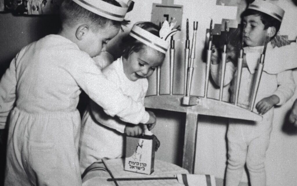 Kindergarten children wearing candle crowns light Hanukkah candles on Mount Carmel and contribute to the building of young Israel through the KKL-JNF Blue Box. Haifa, 1955. Credit KKL-JNF Photo Archive.jpg Kindergarten children wearing candle crowns light Hanukkah candles on Mount Carmel and contribute to the building of young Israel through the KKL-JNF Blue Box. Haifa, 1955. Credit KKL-JNF Photo Archive.jpg