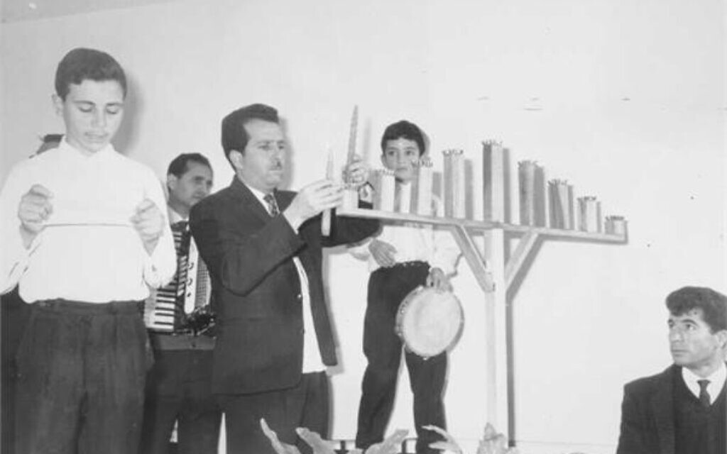 Lighting-the-Menorah-during-Hanukkah-in-Jerusalem-1967.-Credit-Martha-Haloig-KKL-JNF-Photo-Archive Lighting-the-Menorah-during-Hanukkah-in-Jerusalem-1967.-Credit-Martha-Haloig-KKL-JNF-Photo-Archive