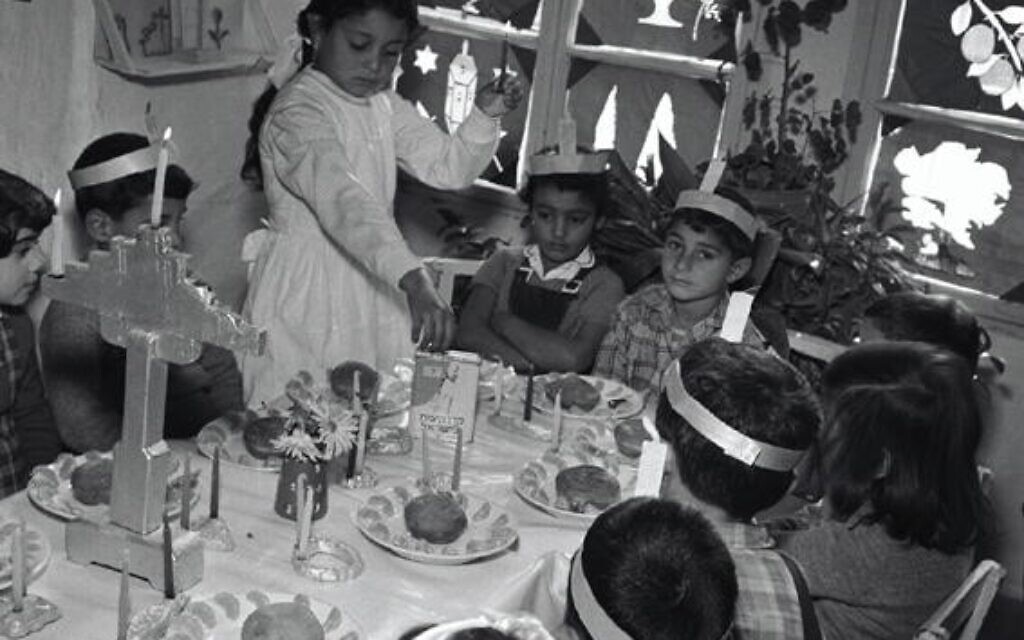Preschool-children-contributing-to-Keren-Kayemeth-LeIsrael-–-Jewish-National-Fund-KKL-JNF-during-Hanukkah-candle-lighting.-Jerusalem-1957.-Credit-Fritz-Schlesinger-KKL-JNF-Archive Preschool-children-contributing-to-Keren-Kayemeth-LeIsrael-–-Jewish-National-Fund-KKL-JNF-during-Hanukkah-candle-lighting.-Jerusalem-1957.-Credit-Fritz-Schlesinger-KKL-JNF-Archive