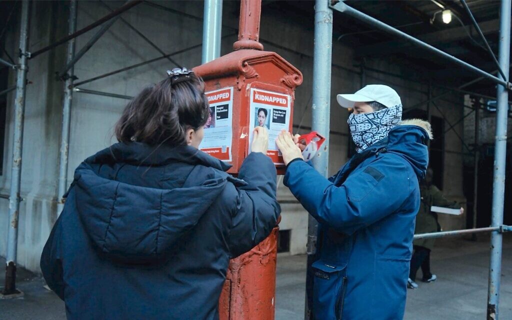Israeli artists Nitzan Mintz, left, and Dede Bandaid were living in New York when the Oct. 7 attack occurred; they designed the posters that eventually appeared all over the world. (Screenshot from "Torn")