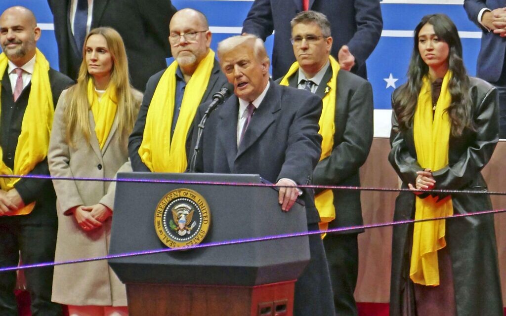 President Donald Trump speaks in front of former Israelis hostages along with families of those still held hostage by Hamas
