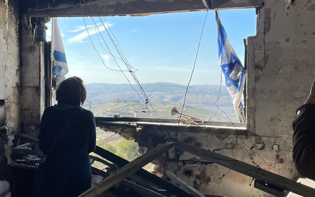 Louise Jacobs, former UJIA Chair, looking out over Lebanon from a destroyed home in Kibbutz Manara. Pic: UJIA
