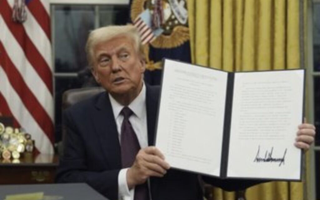 President Trump holds up executive order
