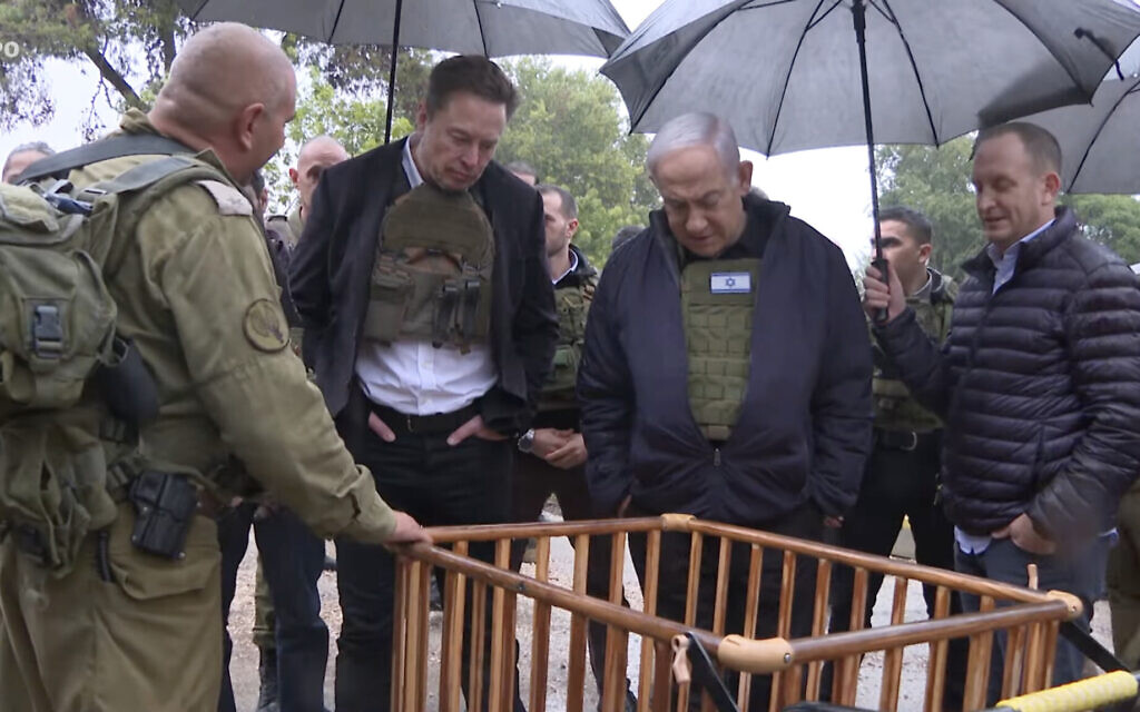 Elon Musk and Israeli Prime Minister Benjamin Netanyahu visit Kibbutz Kfar Aza, which was attacked by Hamas on Oct. 7, on Nov. 27. 2023. (Screenshot from Israeli Prime Minister’s Office video)