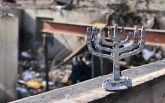 Aimee Miculka found the melted form of a family menorah when her home in Colorado burned in a wildfire in 2021. (Courtesy Miculka)