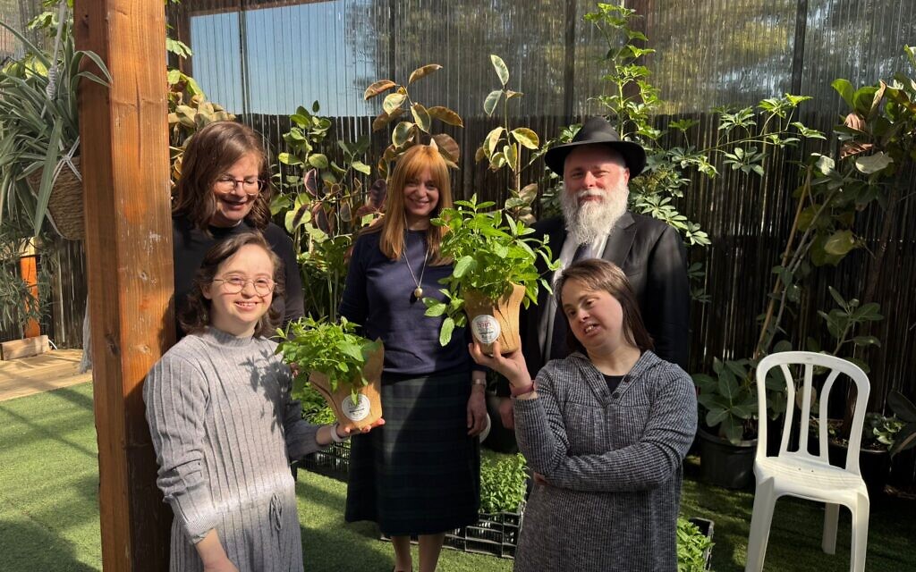 Students at Jewish school in Kyiv plant seedlings cultivated by young women with special needs from Israel’s Ohel Sarah organisation.