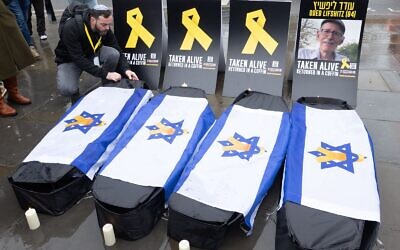 Four symbolic coffins for Oded Lifshitz and the Bibas family, murdered by Hamas
