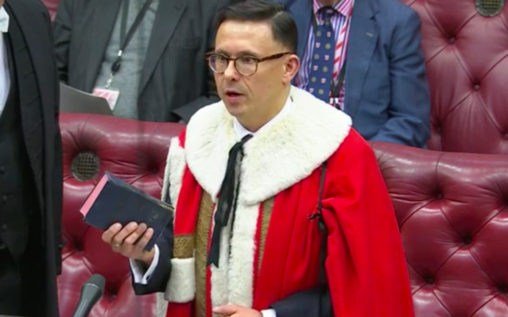 Lord Katz, holding Siddur passed on to him by his parents, as he is introduced to the Lords