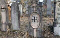 Desecrated headstones at the cemetery in Humenne, Slovakia