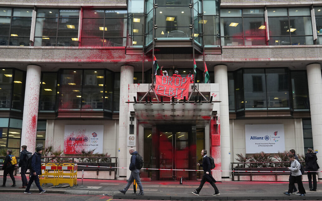 Members of Palestine Action occupy and deface the entrance of a branch of Allianz Insurance commercial offices in Gracechurch Street, London