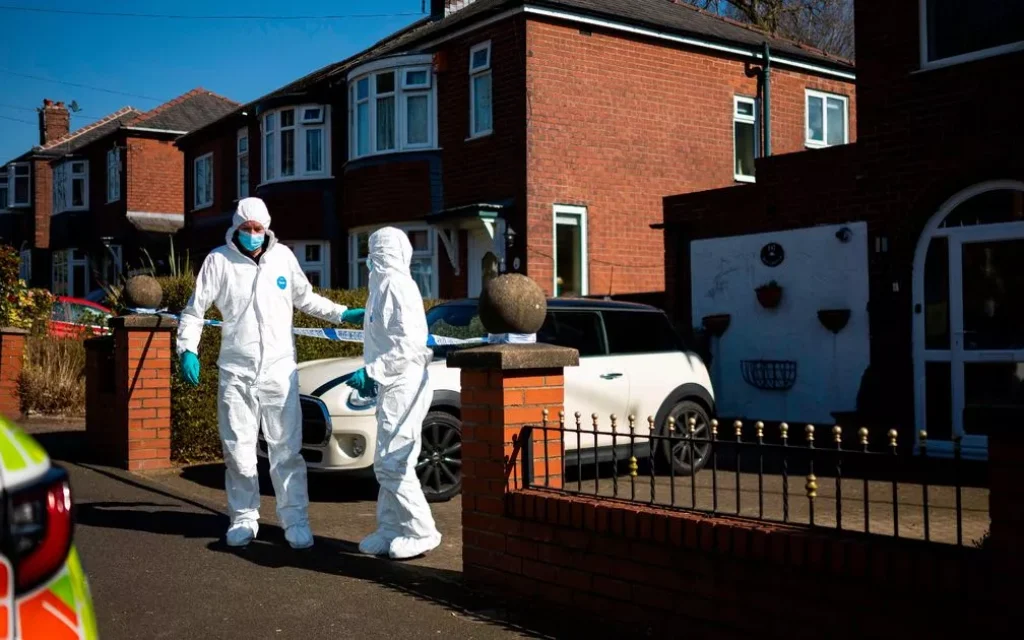 Forensics at the scene of the murder. Photo Credit:Jake Lindley / Manchester Evening News
