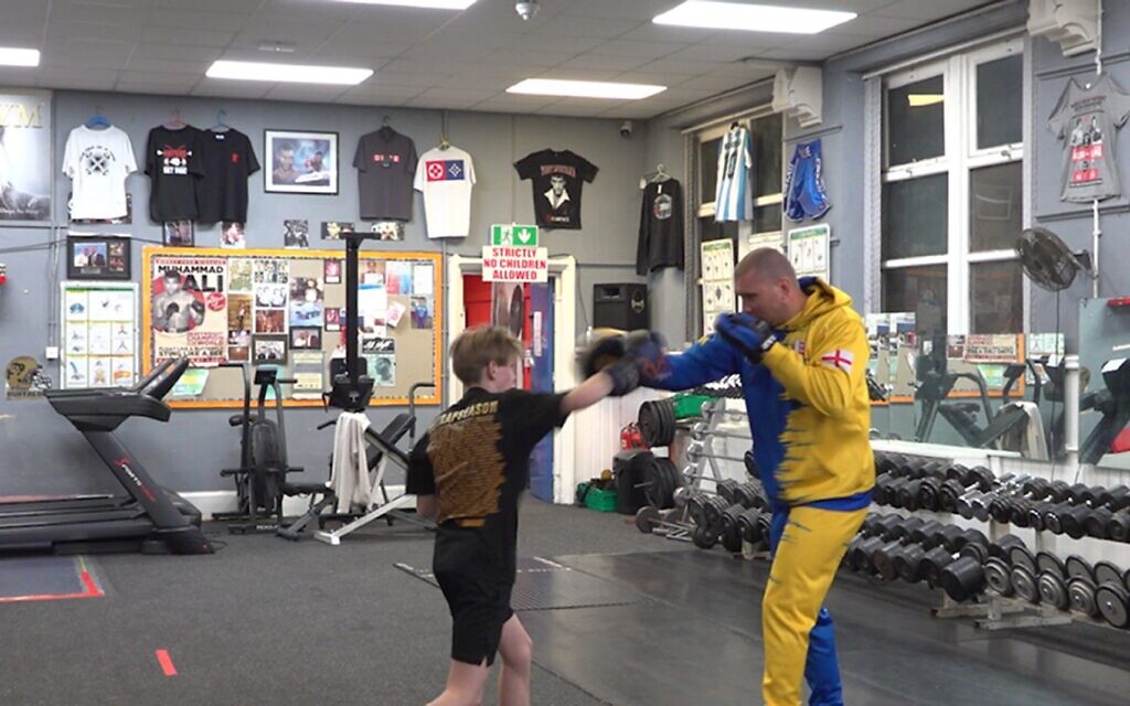 Oleksandr Pohodin trains a young student at his Sheffield boxing academy, opened after fleeing war-torn Ukraine with his family.
