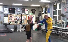 Oleksandr Pohodin trains a young student at his Sheffield boxing academy, opened after fleeing war-torn Ukraine with his family.