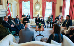 Adam Wagner and Adam Rose seated at hostages meeting with PM Starmer and Foreign Sec Lammy