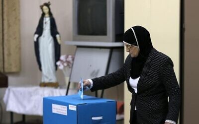 An Israeli Arab casts her vote at a polling station in a previous election. Photo Credit: Reuters