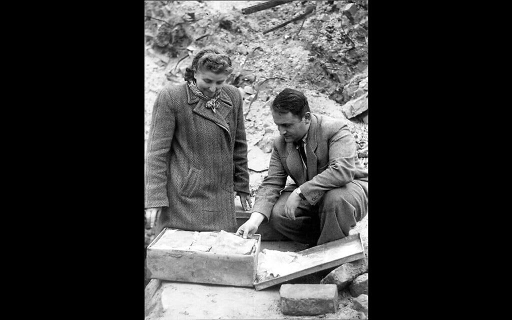 Courtesy of Yad Vashem Photo Archives, Jerusalem. Rachel Auerbach and Hirsh Wasser unearthing the hidden Oneg Shabbat archives in September 1946.