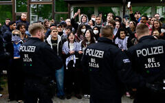 Pro-Palestinian activists face police forces at the university campus of the Free University of Berlin, Germany,