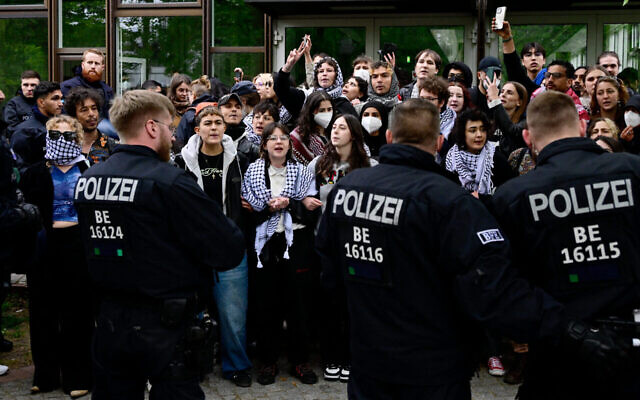 Pro-Palestinian activists face police forces at the university campus of the Free University of Berlin, Germany,