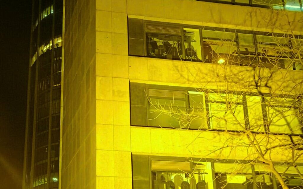 The British Red Cross headquarters in London lit up yellow by CAA in solidarity with hostages held in Gaza. Photo Credit: CAA