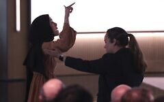 Ibtihal Aboussad is removed by security after interrupting Microsoft’s AI chief during a protest. Photo taken from X