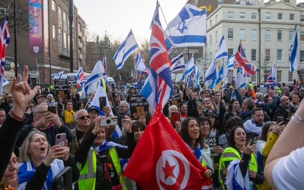 Pro-Israel demonstrators wave Israeli and British flags outside SOAS in a united stand against campus antisemitism. Photo Credit: Jude Sacks