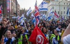 Pro-Israel demonstrators wave Israeli and British flags outside SOAS in a united stand against campus antisemitism. Photo Credit: Jude Sacks