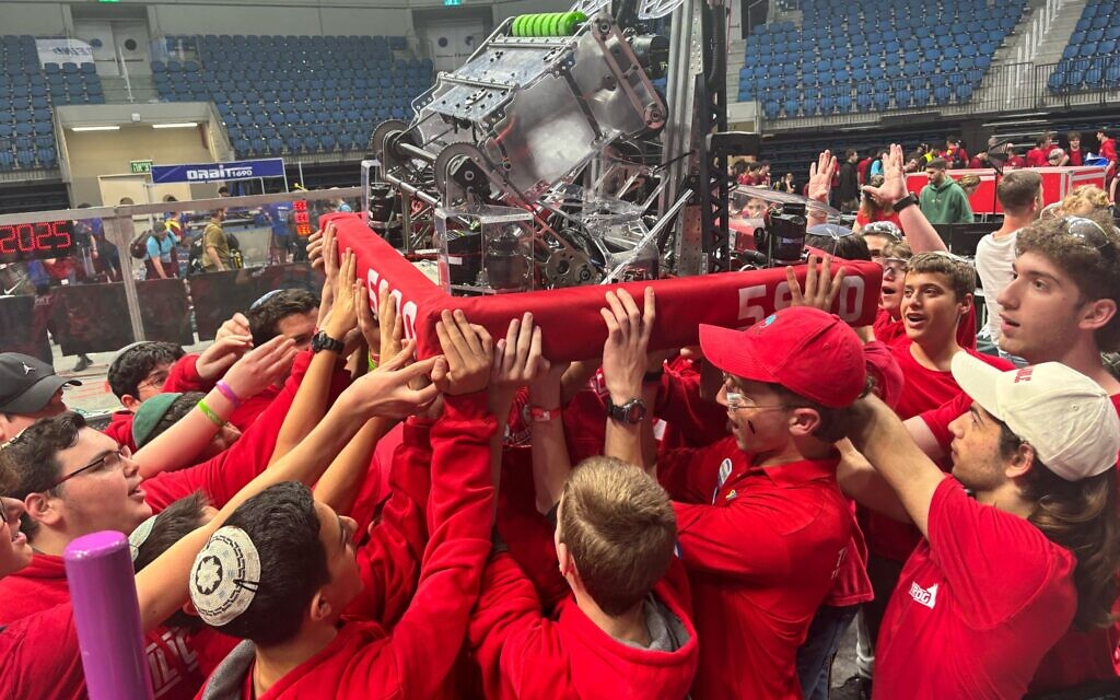Team Trigon 5990 at the FIRST Robotics Championship in Houston, where they reached the final stages before withdrawing for Shabbat.