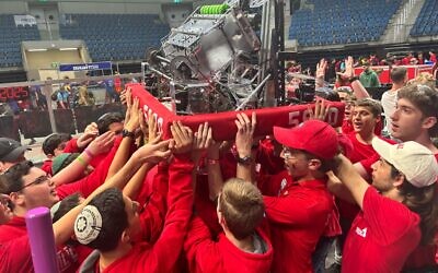 Team Trigon 5990 at the FIRST Robotics Championship in Houston, where they reached the final stages before withdrawing for Shabbat.
