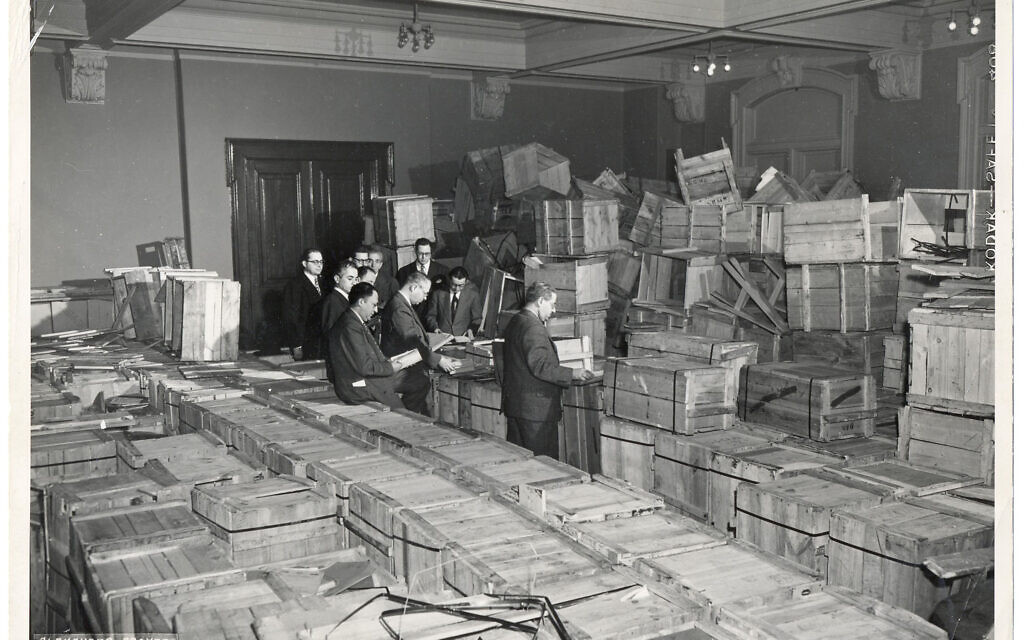 Leaders of the New York-based YIVO open crates of salvaged YIVO treasures from Europe. New Jersey, 1947. Credit: YIVO Institute for Jewish Research