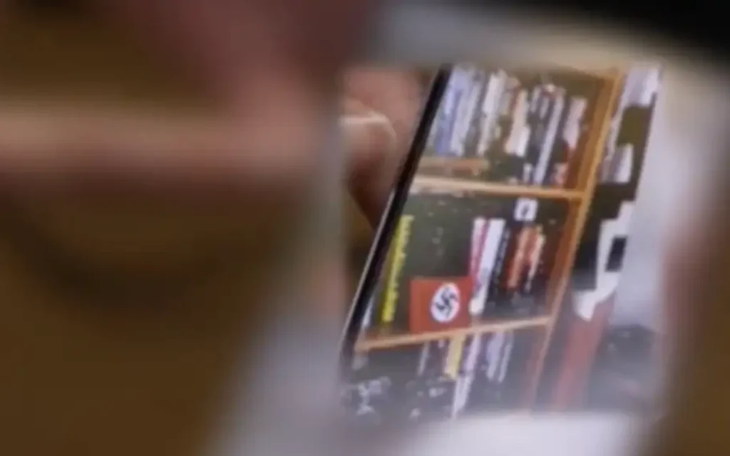 A South East Coast Ambulance Service manager appeared on a work call with Nazi symbols visible in the background. (Photo Credit: Sky News)