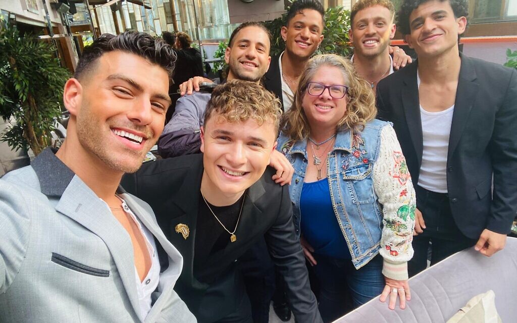 Jewish News groupie Michelle Rosenberg with the six members of As1One