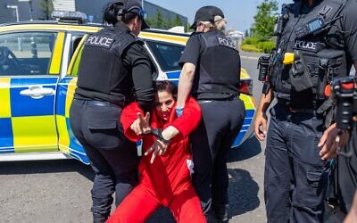 Rahmeh Aladwan is arrested near the front gates of the Elbit Systems Filton site.  Credit Milo Chandler/Alamy Live News