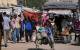 Displaced Palestinians flee from Khan Younis, Gaza, amid the ongoing Israeli military offensive in the area, on Monday, May 19, 2025. (AP Photo/Abdel Kareem Hana)