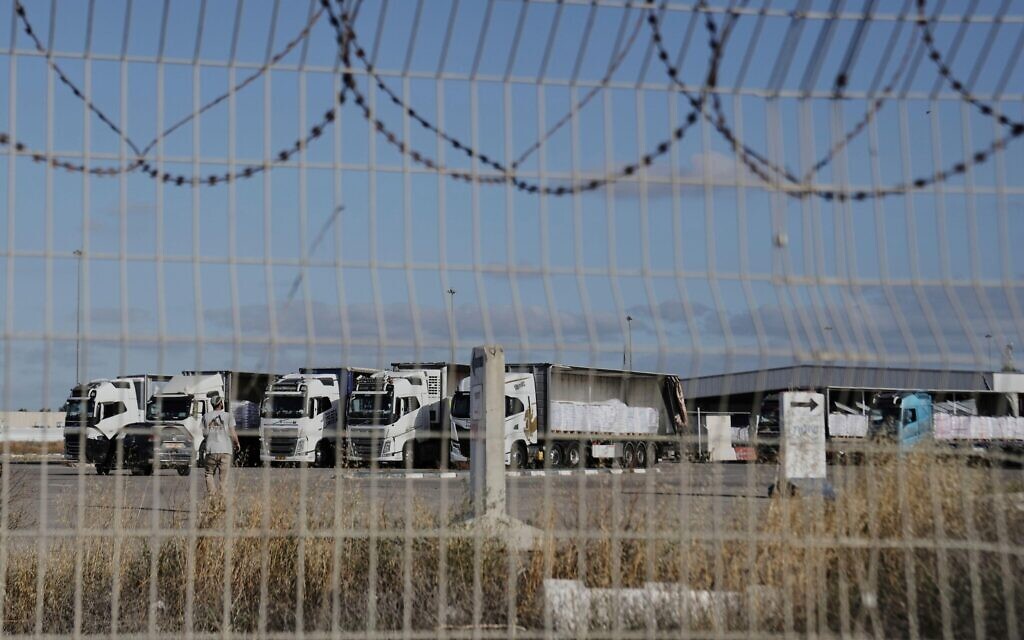 Trucks load with humanitarian aid for the Gaza Strip are seen at the Kerem Shalom Crossing in southern Israel, Tuesday May 20, 2025. (AP Photo/Maya Alleruzzo)