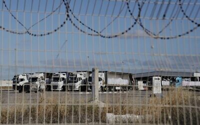 Trucks load with humanitarian aid for the Gaza Strip are seen at the Kerem Shalom Crossing in southern Israel, Tuesday May 20, 2025. (AP Photo/Maya Alleruzzo)