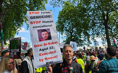 Peter Tatchell at Saturday’s Nakba Day march in London holding placard condemning Hamas and Israeli actions. Photo Credit: Peter Tatchell/X