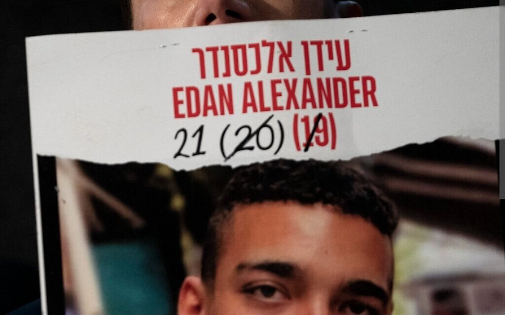 Edan Alexander’s mother holds a poster of her son, the last known American-Israeli hostage believed to be alive in Gaza. Photo taken from X
