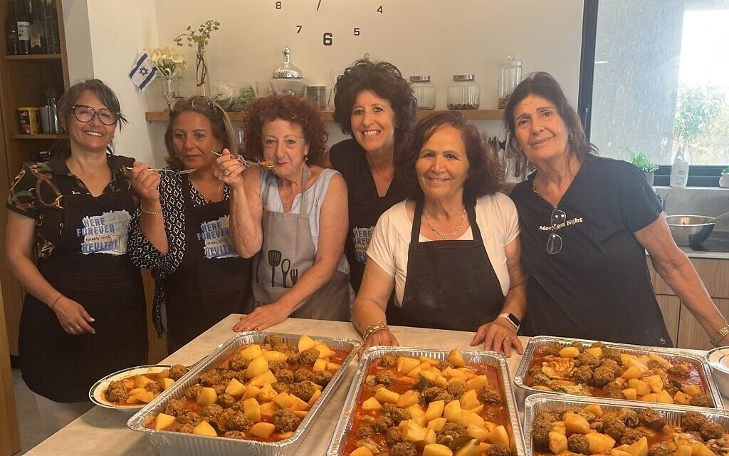 Revital’s Hamal volunteers packing care boxes for IDF soldiers. Photo credit: Revital’s Hamal / Facebook