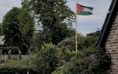 A Palestinian flag seen flying above a Jewish cemetery in Plymouth. Photo Credit: Plymouth Plus / TikTok