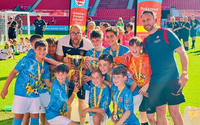Wolfson Hillel players and coaches lift the national trophy after their 2–0 victory in the ESFA Pokémon Cup final.
Photo Credit: Wolfson Hillel