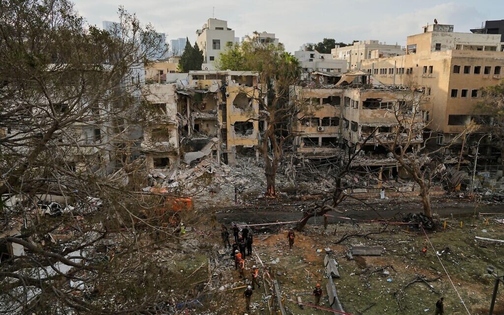 Rescue team work at the site where a missile launched from Iran struck Tel Aviv, Israel, Monday, June 16, 2025. (AP Photo/Baz Ratner)