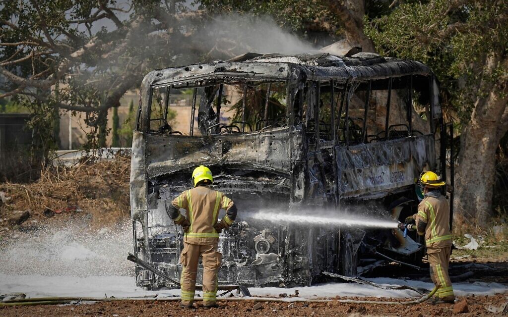 Firefighters work at site hit by a missile launched from Iran in central Israel on Tuesday, June 17, 2025. (AP Photo/Baz Ratner)
