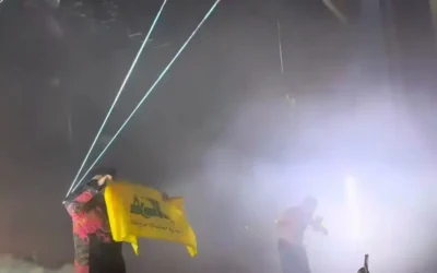 Hezbollah terror flag raised by the band Kneecap at a London concert. Image: Social media
