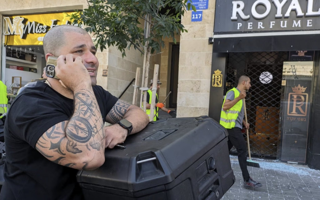 Rashad stands outside one of his stores in Jaffa, Israel, following damage from a blast related to an Iranian missile strike, 19 June, 2025. (Deborah Danan)