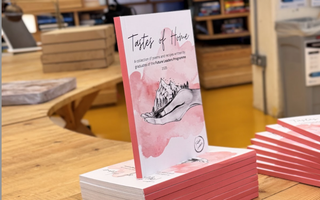 Copies of Tastes of Home, a new poetry and recipe book written by graduates of the Future Leaders programme, on display at the “Voices of Home” showcase. Photo Credit: Sule Ceyda Karakus