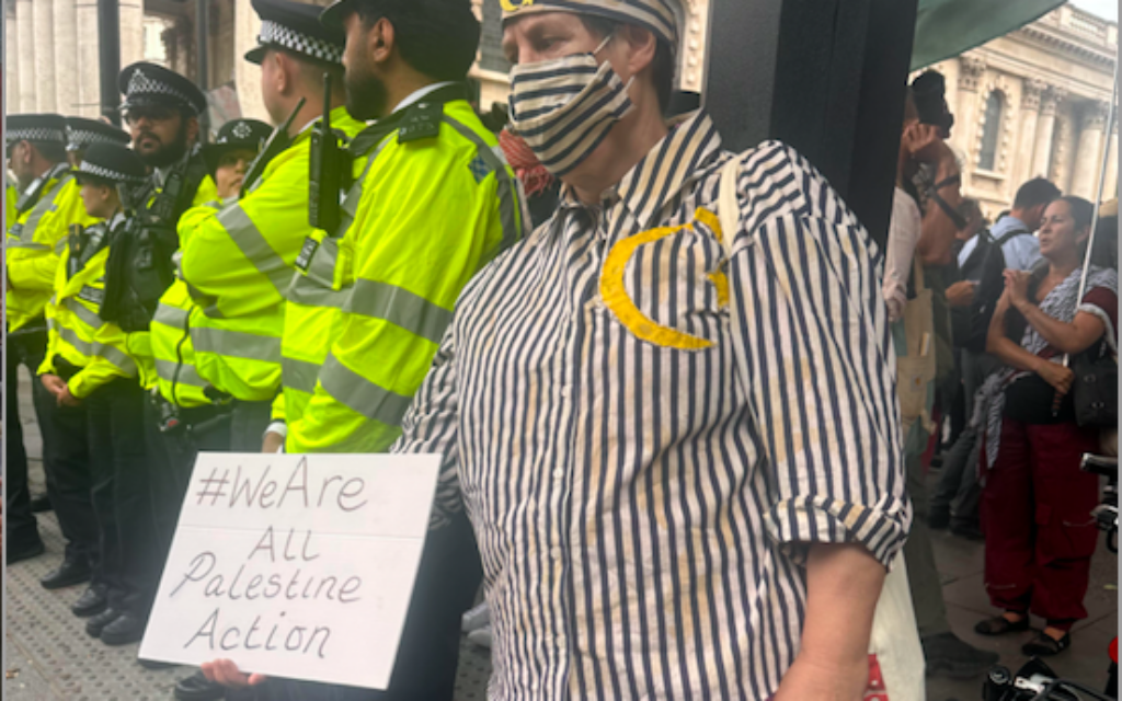 Palestine Action supporter dresses in concentration camp uniform at Trafalgar  Sq demo