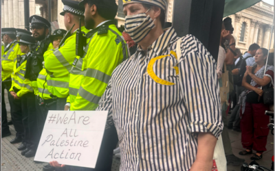 Palestine Action supporter dresses in concentration camp uniform at Trafalgar  Sq demo